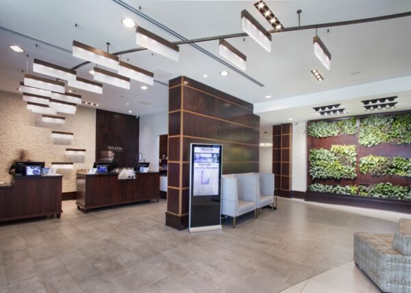 A large grey business welcome area remodeled by Seven Trees Woodworking