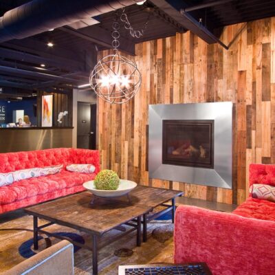 Warehouse Motel's fireplace and lounge remodeled by custom commercial millworkers from Seven Trees Woodworking