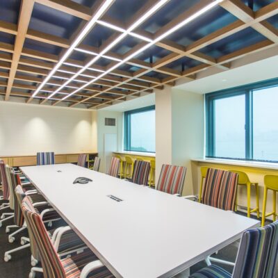 A conference room remodeled by custom commercial millworkers from Seven Trees Woodworking