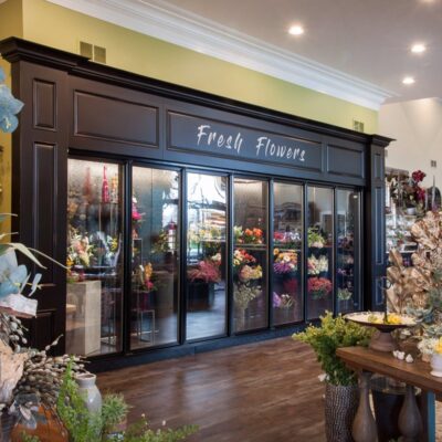 A retail store's entrance to their flower section (remodeled by custom millworkers from Seven Trees Woodworking)